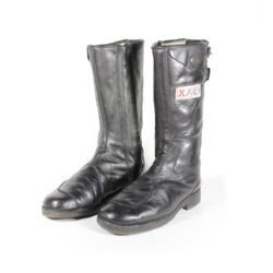 A pair of used black vintage touring motorcycle boots, size 42, made of leather with visible wrinkling and minor scratches on the surface. The boots feature reinforced toe and gear lever protection.