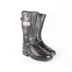A pair of used black vintage touring motorcycle boots, size 42, made of leather with visible wrinkling and minor scratches on the surface. The boots feature reinforced toe and gear lever protection.