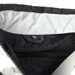 A used silver Bering touring textile jacket for women in size L. In good condition with minor wear marks, it features shoulder and elbow protection, reflectors, and a short connection zipper. The thermal inner liner is missing