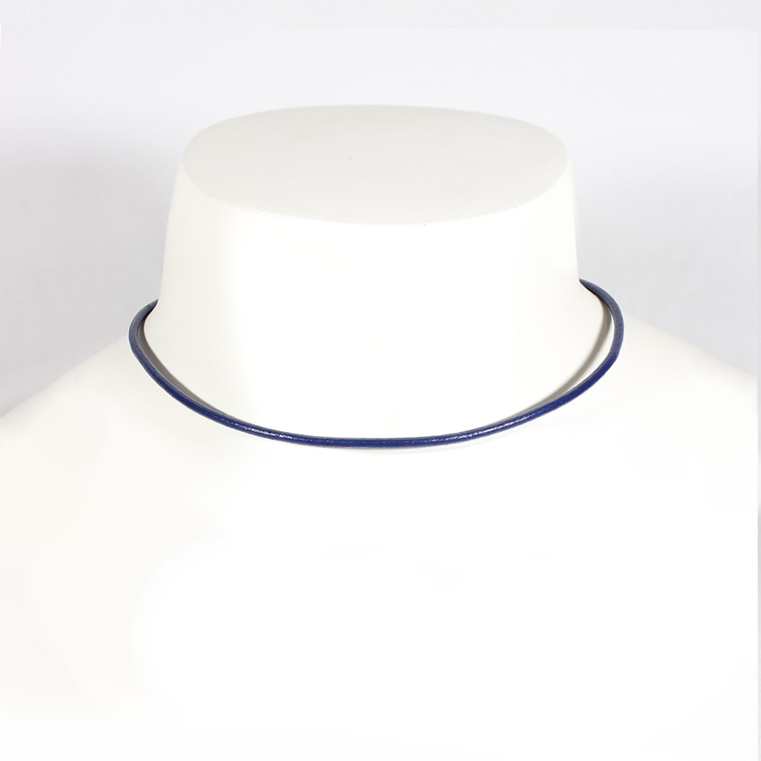 A royal blue Nappa leather watch strap with a stainless steel buckle, shown alongside a watch face to demonstrate its sleek and versatile design.