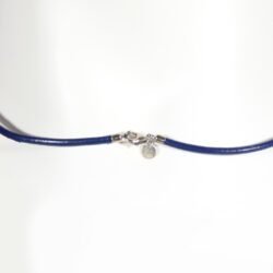 A royal blue Nappa leather watch strap with a stainless steel buckle, shown alongside a watch face to demonstrate its sleek and versatile design.