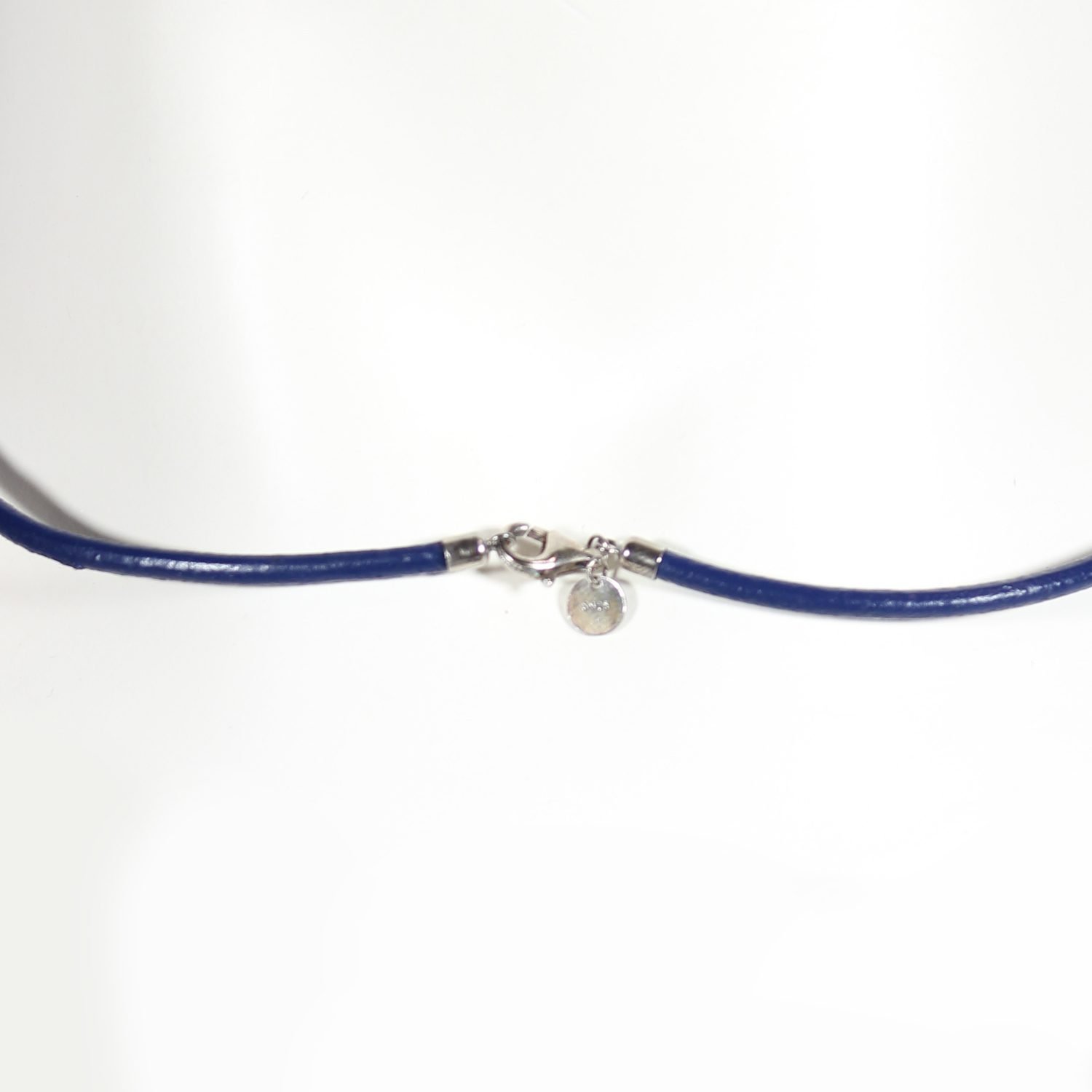 A royal blue Nappa leather watch strap with a stainless steel buckle, shown alongside a watch face to demonstrate its sleek and versatile design.