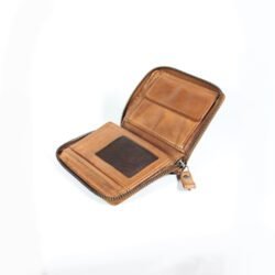 vintage brown leather men's wallet, open to show card slots and money clip, on a dark background