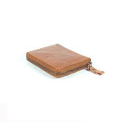 vintage brown leather men's wallet, open to show card slots and money clip, on a dark background