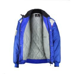 A used blue and crème Dainese Eddie Lawson vintage textile jacket in size 54. In very good condition with minor wear and small spots, it features a classic old-school design with removable sleeves and a hidden large pocket.