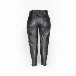 Used Damen Leathers black vintage leather pants with an adjustable leg string for fit, showing minor scratches and wrinkles from age.