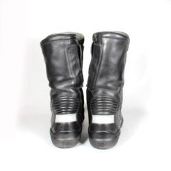 A pair of used black Daytona Spirit XCR touring and city boots in size 42, crafted from leather with comprehensive protection for heel, toes, gear lever, ankle, and calf. Features a waterproof membrane and is in good overall condition with no major defects