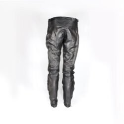A pair of used black Hein Gericke leather pants in a vintage Café Racer style, size 56 (94 cm waist). In good condition (7.5/10) with minor use marks. Features include soft foam knee protection, an adjustable waist with a stretch panel and built-in belt, two front pockets, and a short connecting zip for a motorcycle jacket.