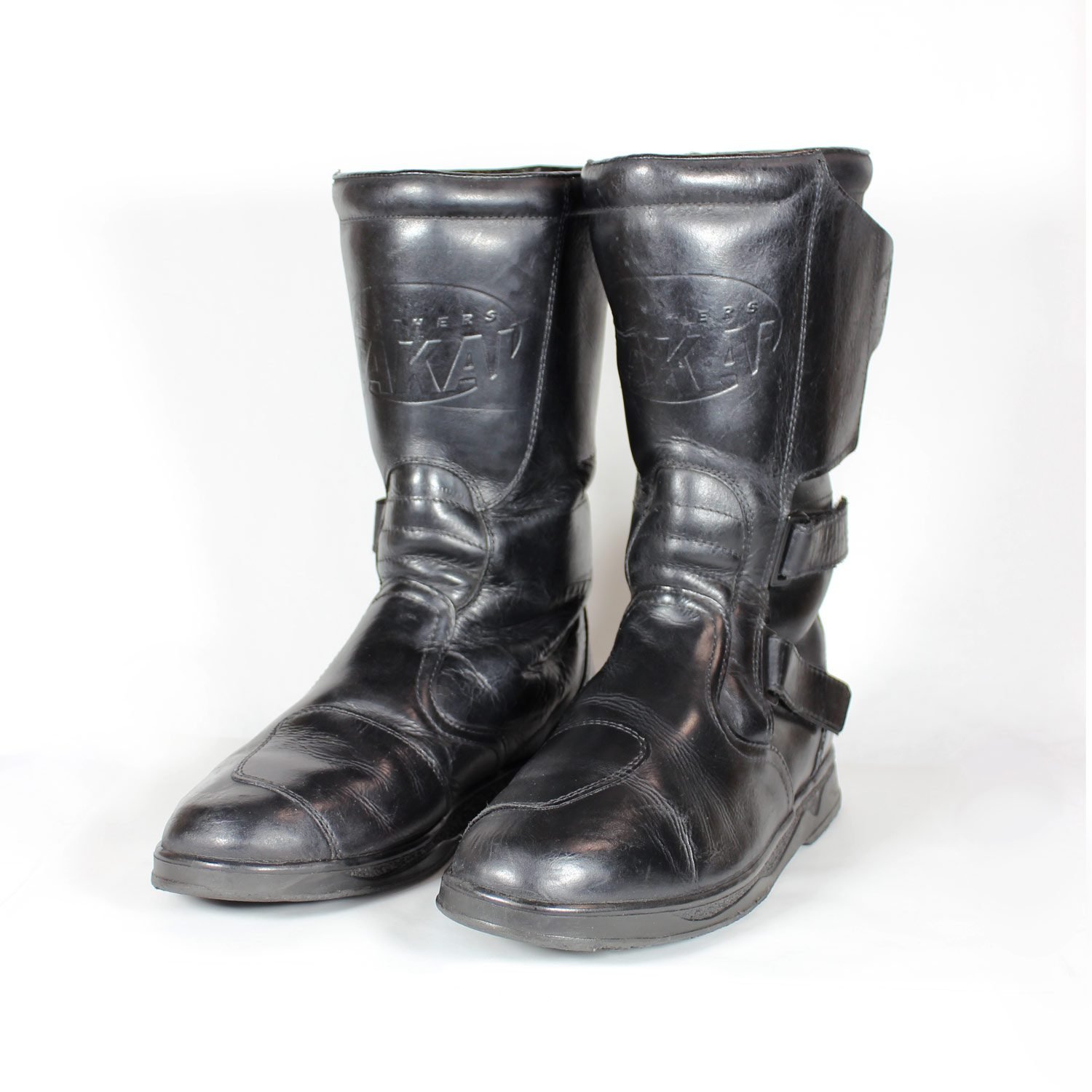 Black leather touring adventure motorcycle boots, size 42, showing small scratches and a light bend on the toe protection