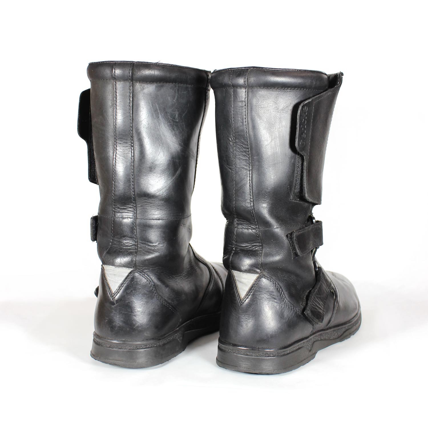 Black leather touring adventure motorcycle boots, size 42, showing small scratches and a light bend on the toe protection