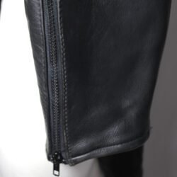 A pair of black Imatra Vintage leather motorcycle pants in size 50 M, designed in a Café Racer style. They are in good condition with minor use marks and feature a stretch waist and thighs for comfort, soft foam knee protection, two front pockets, and a short zipper to connect to a jacket.