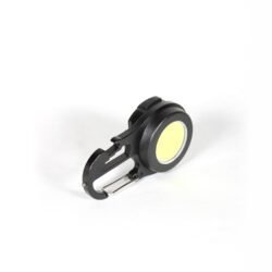 A compact black keychain flashlight with a magnetic base, shown attached to a metal surface, highlighting its USB-C port, dual LED lamps, and multifunctional lighting modes for outdoor use.