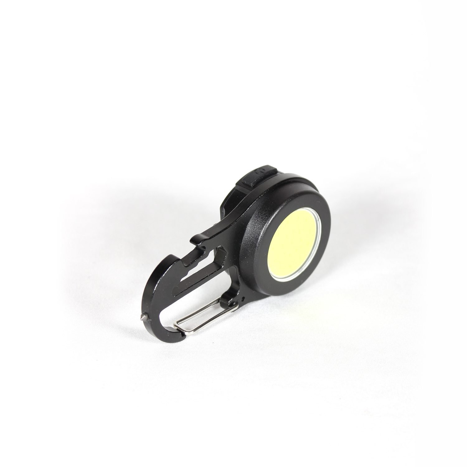 A compact black keychain flashlight with a magnetic base, shown attached to a metal surface, highlighting its USB-C port, dual LED lamps, and multifunctional lighting modes for outdoor use.