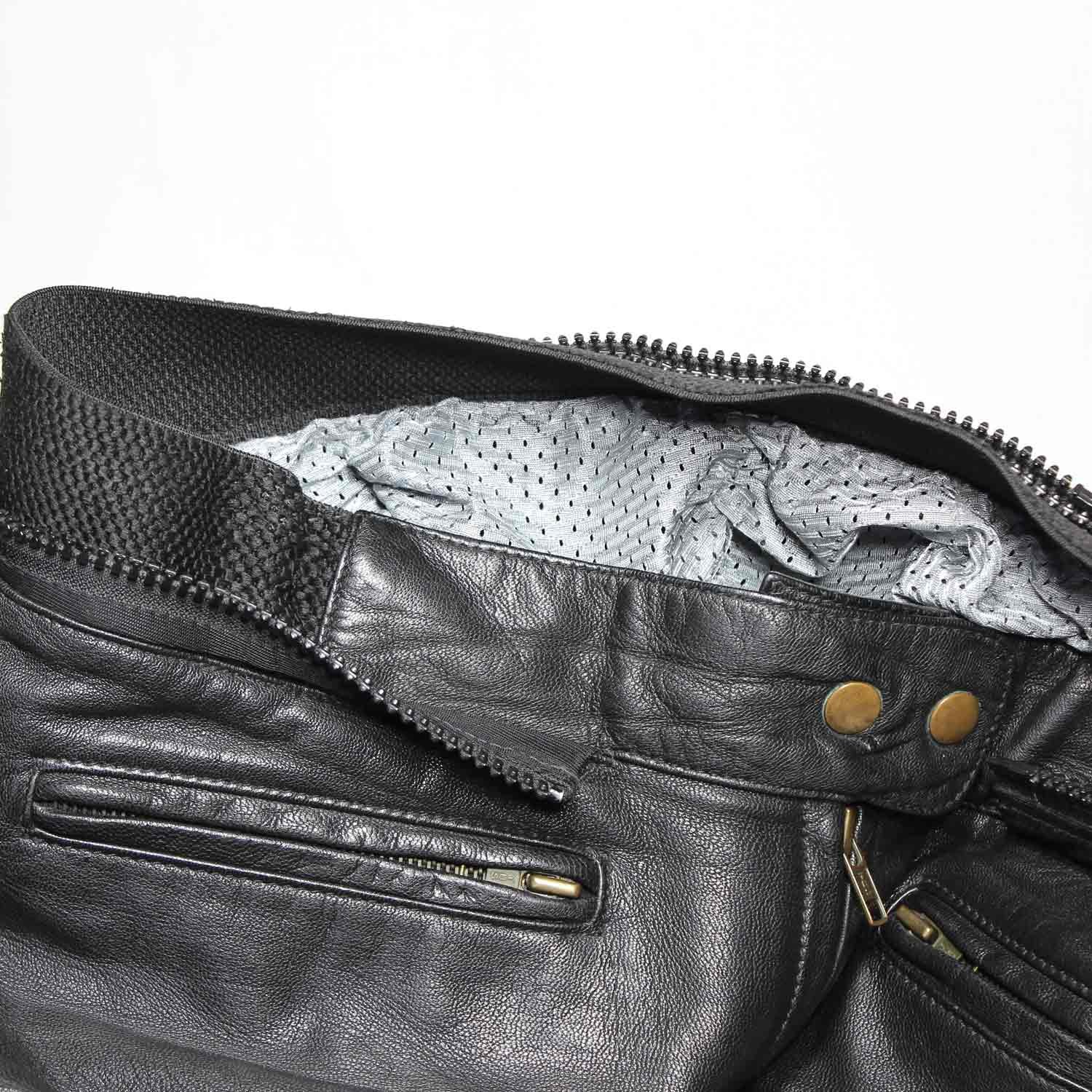 A pair of pre-owned black leather motorcycle trousers in a cafe-racer style, size 44. Condition is good with minor age-related wear including potential elastic weakening and light scratching on the reflective safety stripes. No protectors included