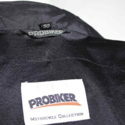 A used black and grey Probiker casual jacket in a mixed leather and textile design, size 50. In good condition with minor wear, it features a DryGate waterproof membrane, a full-circumference zipper for pants, and comes without the thermal liner