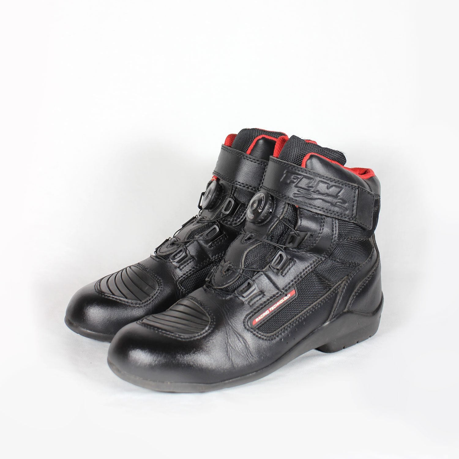 A pair of used black FLM short street boots in size 41, designed for city riding. Constructed from faux leather and textile with protection for heel, toes, gear lever, and ankle. Features a waterproof membrane and shows minor scratches.