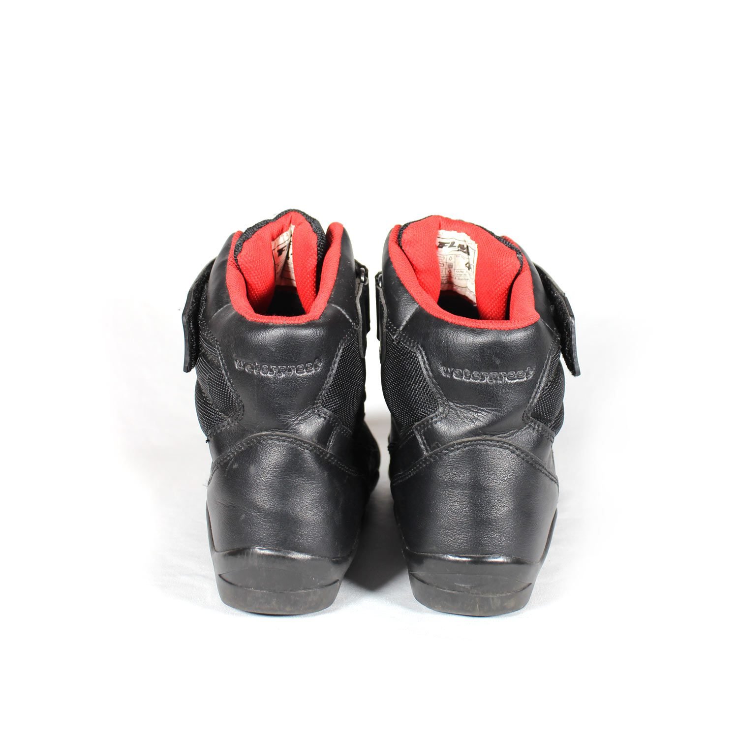 A pair of used black FLM short street boots in size 41, designed for city riding. Constructed from faux leather and textile with protection for heel, toes, gear lever, and ankle. Features a waterproof membrane and shows minor scratches.