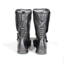 A pair of used black touring and city motorcycle boots in size 39, crafted from leather with minor surface scratching. Features reinforced toe, gear lever, and heel protection.