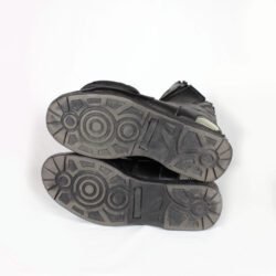 A pair of used black women's touring and street motorcycle boots in size 38, crafted from leather and faux leather with reinforced heel, toe, gear lever, and slider protection. Features a waterproof membrane and shows minor surface scratches.