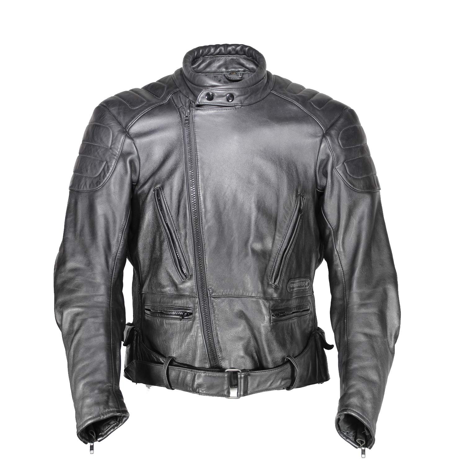 A used black Uvex Sportstyle vintage leather jacket in size 56. In very good condition with only minor aging marks, it features reinforced leather on the elbows, shoulders, and lower back, and a short zipper to connect to pants.