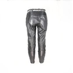 Used Vanucci black leather Café-Racer pants with hip and knee foam protection, featuring connection zippers and perforated ventilation. Shows minor wear and scratches.
