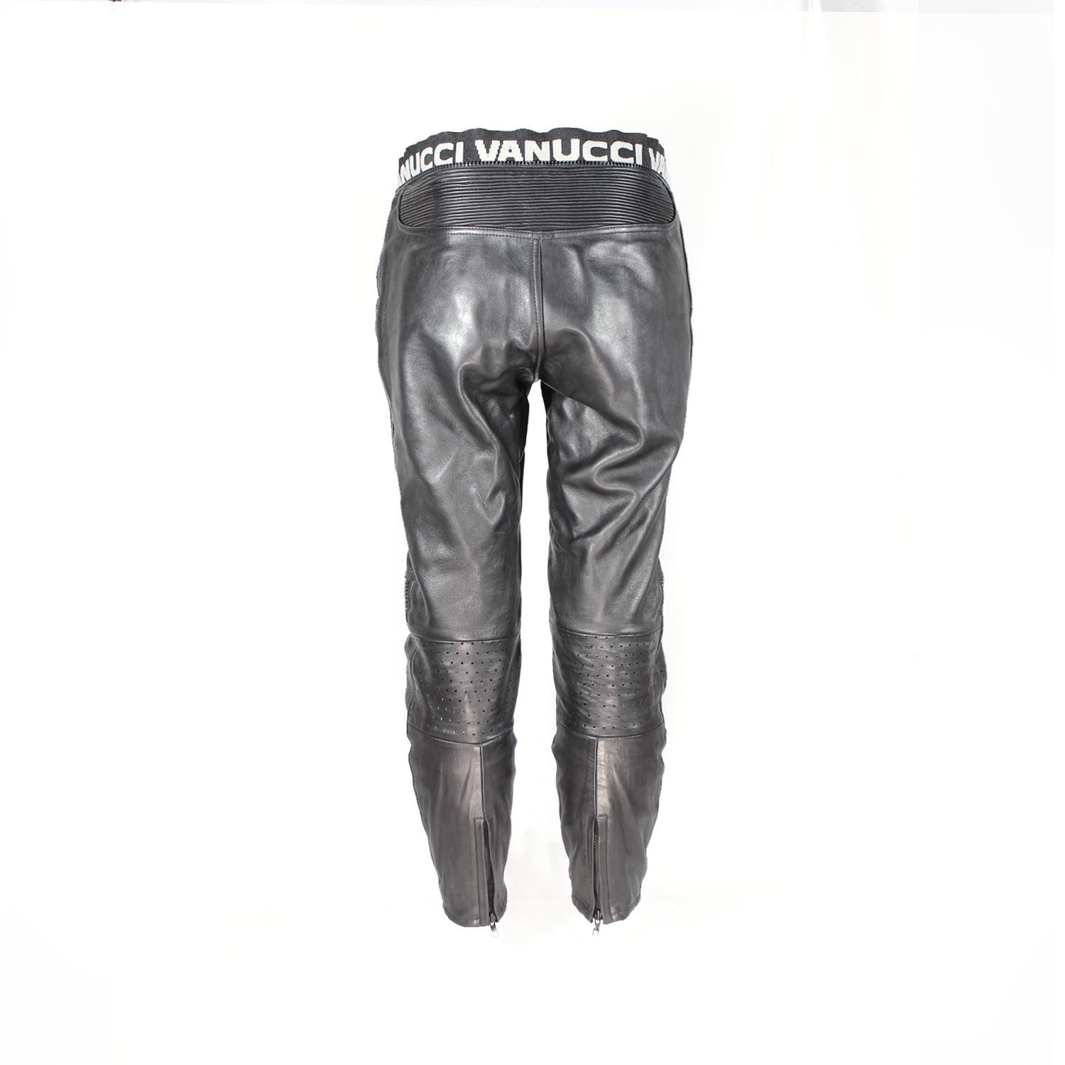 Used Vanucci black leather Café-Racer pants with hip and knee foam protection, featuring connection zippers and perforated ventilation. Shows minor wear and scratches.