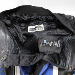 interior Used black and blue Vanucci Track racing leather pants in size 52, featuring a stretch fit for an 80-84 cm waist. Condition is good with very minor surface scratches. Includes foam knee protectors, thigh air vents, and connection zippers for a combi jacket. Features 3M Scotchlite reflective material and can be upgraded with knee sliders for a performance-focused race suit.