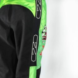 A pair of used black and green Zehetner Sportwear Cross pants in size XXL, featuring a Cross/Vintage style. Made of textile, they are in very good condition with no protectors and are not waterproof.