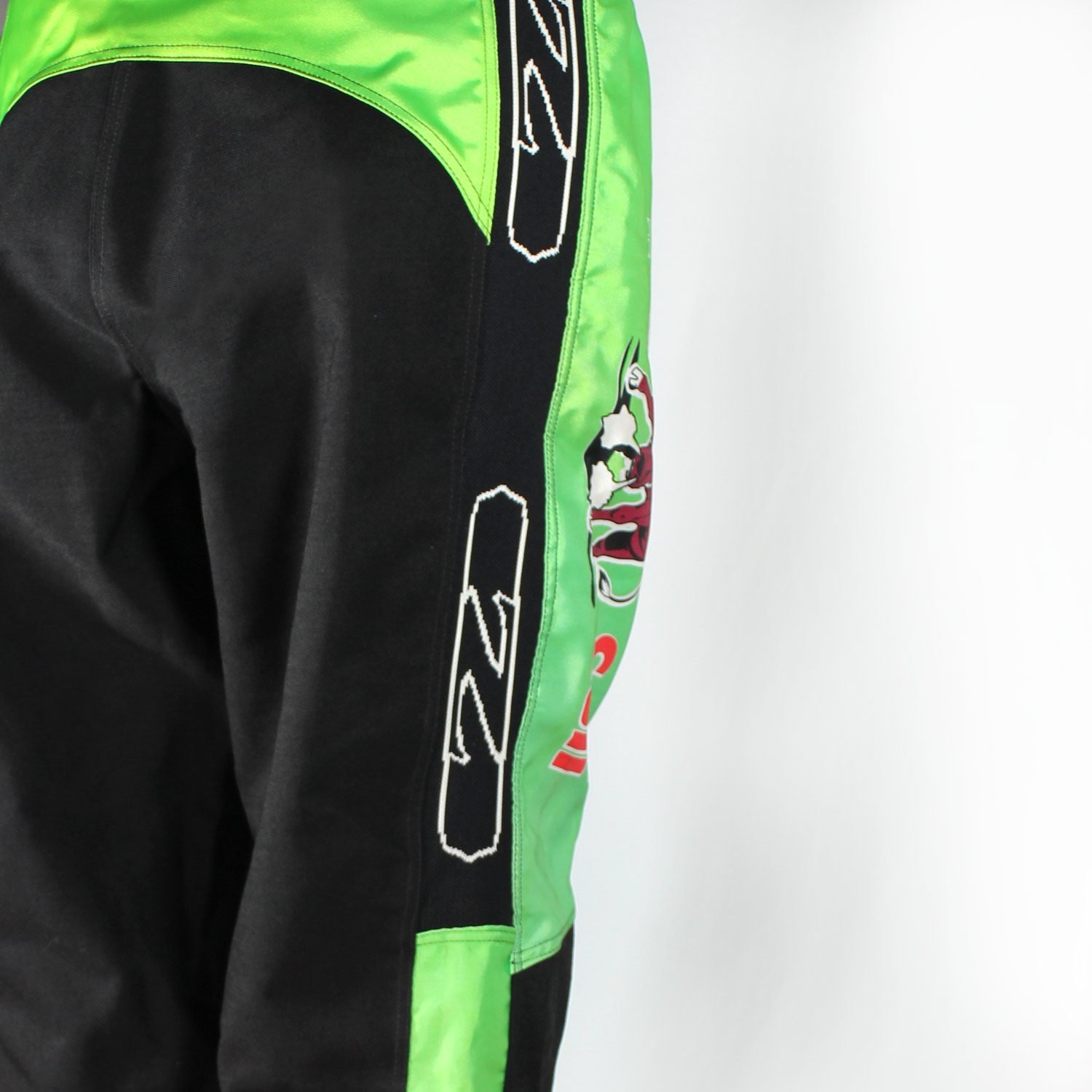 A pair of used black and green Zehetner Sportwear Cross pants in size XXL, featuring a Cross/Vintage style. Made of textile, they are in very good condition with no protectors and are not waterproof.