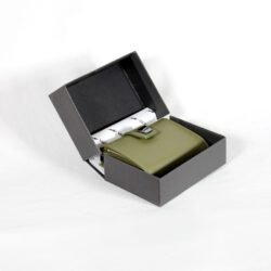 A slim, modern men's wallet with a pop-up card mechanism, multiple compartments, and RFID protection, shown in a gift box