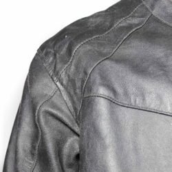 Used Rider-Tec black leather touring jacket with shoulder, elbow, and back protection, ventilation vents, and a combi-jacket connection zipper. Shows minor wear marks.