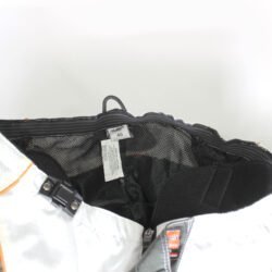 Used Bolder black and white cross pants with removable hip protectors and a Cordura waterproof membrane, showing minor wear and slight fading.