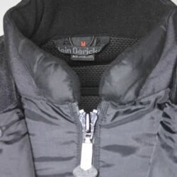 Used Hein Gericke black and red all-season touring jacket with Cordura fabric, shoulder, elbow, and back protection, a waterproof membrane, and reflective panels.