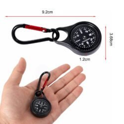 A silver metal compass with a luminous dial and a black carabiner clip.
