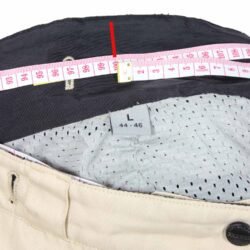 Used Polo Pharao black and crème adventure pants with knee protection, convertible into shorts, featuring large air vents and a combi-jacket connection zipper.