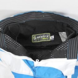 Used Scott Series 350 blue and white cross pants with hip protection and an adjustable waist, showing minor wear marks.