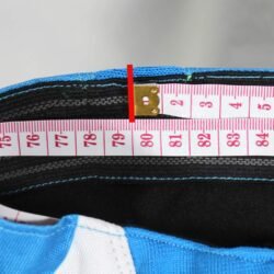 Used Scott Series 350 blue and white cross pants with hip protection and an adjustable waist, showing minor wear marks.