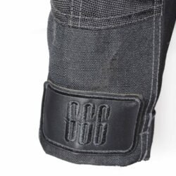 Used Richa black textile touring jacket with a Reissa waterproof membrane, shoulder, elbow, and back protection, ventilation vents, and a connection zipper. Shows minor wear and a repair patch.