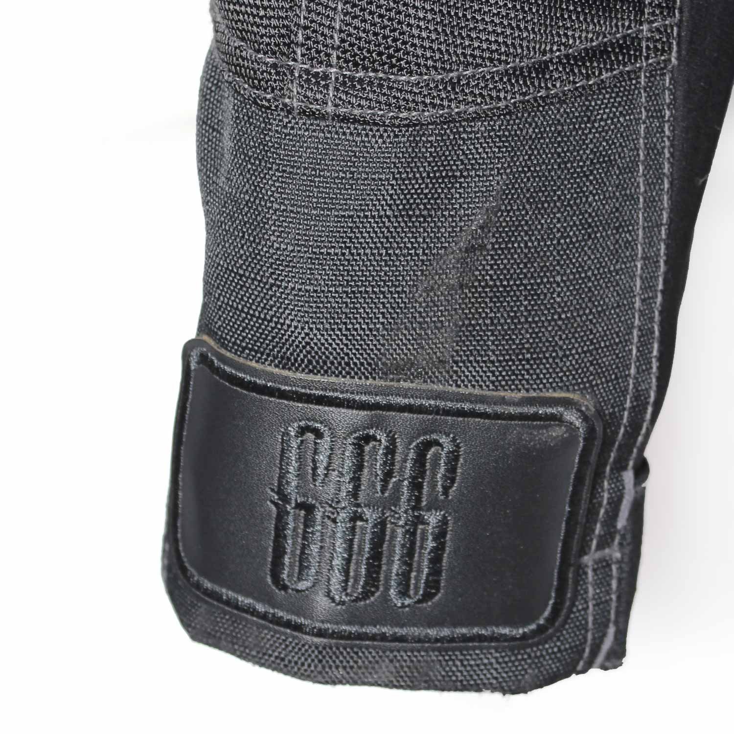 Used Richa black textile touring jacket with a Reissa waterproof membrane, shoulder, elbow, and back protection, ventilation vents, and a connection zipper. Shows minor wear and a repair patch.