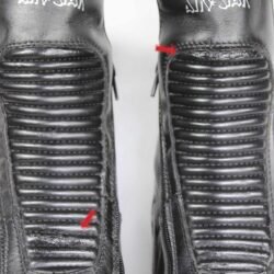 A pair of black leather Air Star street boots in size 42. The boots feature protection for the toes, shin, ankles, and heels, a reinforced sole, gear/brake lever protection, and reflectors. They show some wear marks, with minor damage to the synthetic leather panels on the front and back.