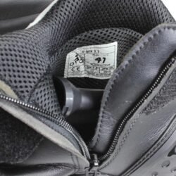 Front view of Alpinestars S-MX 1.1 KTM powerwear motorcycle shoes in size 41. The shoes are made of black and white synthetic leather, featuring accordion flex panels on the sides, a reinforced toe box, and prominent gray TPU sliders on the heel and ankle.