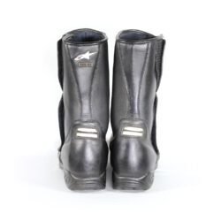 A pair of black leather Alpinestars Touring Classic boots in size 39. The boots feature a Gore-Tex waterproof membrane and protective reinforcements on the toes, shin, ankles, and heel, along with a reinforced sole, gear lever protection, and rear reflectors. They show minor wear marks.