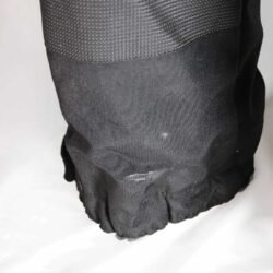 A pair of black AXO textile touring trousers in size 50. They feature a Miporex waterproof membrane and come with protectors for the knees and shins. The trousers are in fairly good condition with some wear marks and a slightly worn elastic waistband.