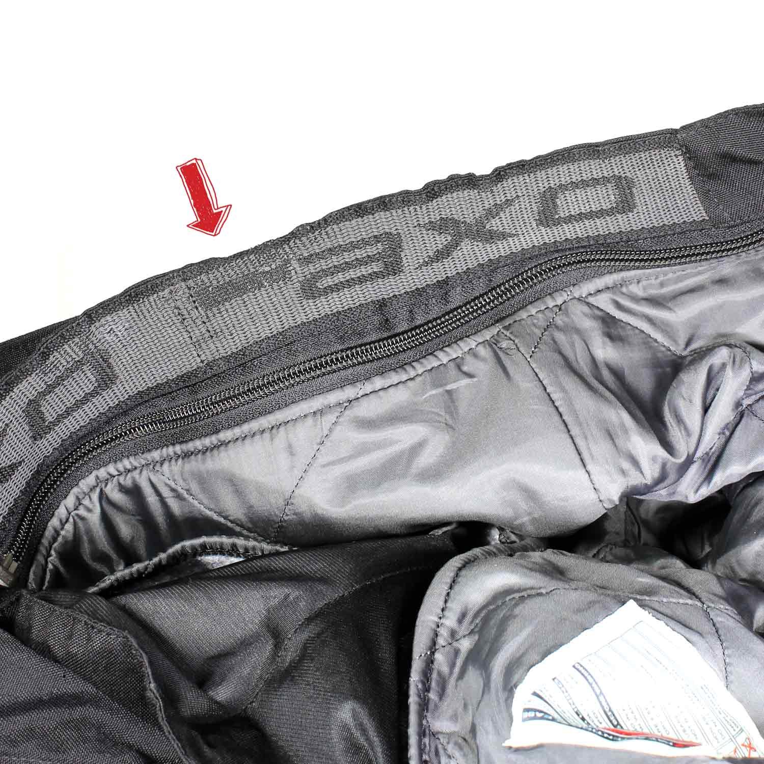 A pair of black AXO textile touring trousers in size 50. They feature a Miporex waterproof membrane and come with protectors for the knees and shins. The trousers are in fairly good condition with some wear marks and a slightly worn elastic waistband.