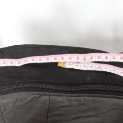 A pair of black AXO textile touring trousers in size 50. They feature a Miporex waterproof membrane and come with protectors for the knees and shins. The trousers are in fairly good condition with some wear marks and a slightly worn elastic waistband.