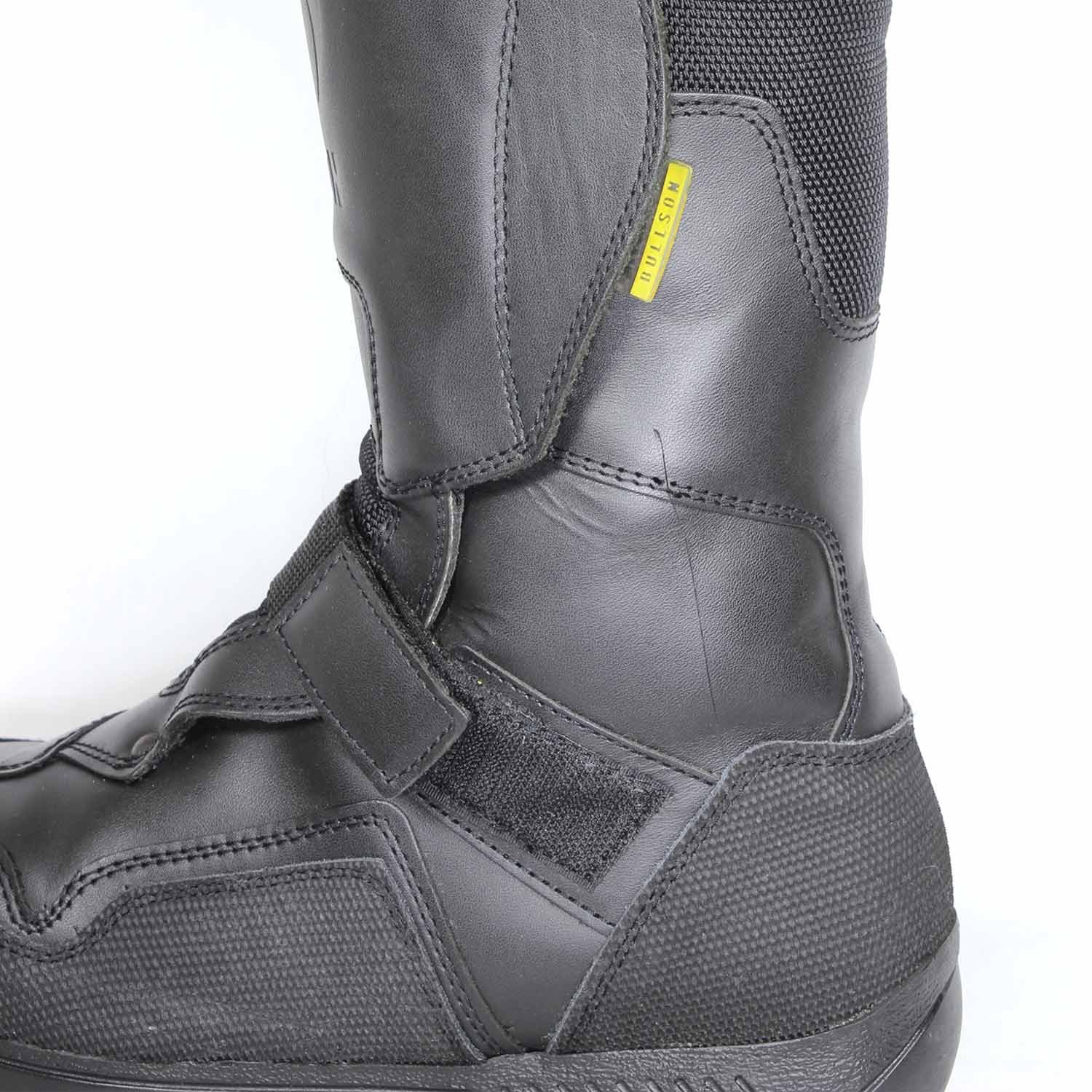 A pair of black leather Hein Gericke Bullson Cycko touring boots in size 37. They feature a Shettex waterproof membrane and protection for the toes, shin, ankles, and heel, with a reinforced sole. The boots show some wear marks, including a deep scratch on the side of the left boot.
