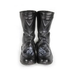 A pair of customized black leather Dainese touring boots in size 40, featuring a unique, artistic paint design applied by the Revver Workshop. The boots offer protection for the toes, shin, ankles, and heel, with a reinforced sole. They show some wear marks and have had the gear and brake lever protectors artistically removed as part of the custom design.