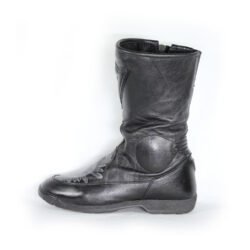 A pair of customized black leather Dainese touring boots in size 40, featuring a unique, artistic paint design applied by the Revver Workshop. The boots offer protection for the toes, shin, ankles, and heel, with a reinforced sole. They show some wear marks and have had the gear and brake lever protectors artistically removed as part of the custom design.