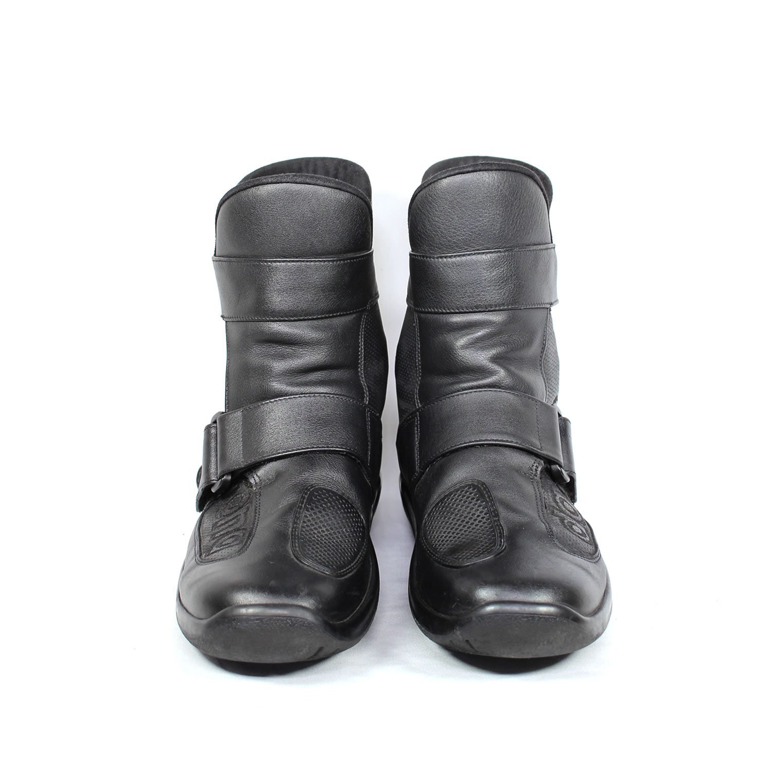 A pair of black leather touring boots, size 41, made in Germany. The boots feature a Gore-Tex membrane for waterproofing and have a high shaft. Key details include ankle protectors on both sides, a reinforced toe box, and a shin protector. The sole is a non-slip rubber with a tire tread pattern. The interior is padded with latex foam for comfort, and the insole is plastic-reinforced with a galvanized steel shank for torsion resistance. Minor wear is visible on the gear lever protection pad and the sole.