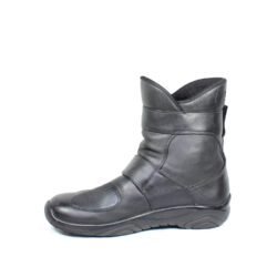 A pair of black leather touring boots, size 41, made in Germany. The boots feature a Gore-Tex membrane for waterproofing and have a high shaft. Key details include ankle protectors on both sides, a reinforced toe box, and a shin protector. The sole is a non-slip rubber with a tire tread pattern. The interior is padded with latex foam for comfort, and the insole is plastic-reinforced with a galvanized steel shank for torsion resistance. Minor wear is visible on the gear lever protection pad and the sole.